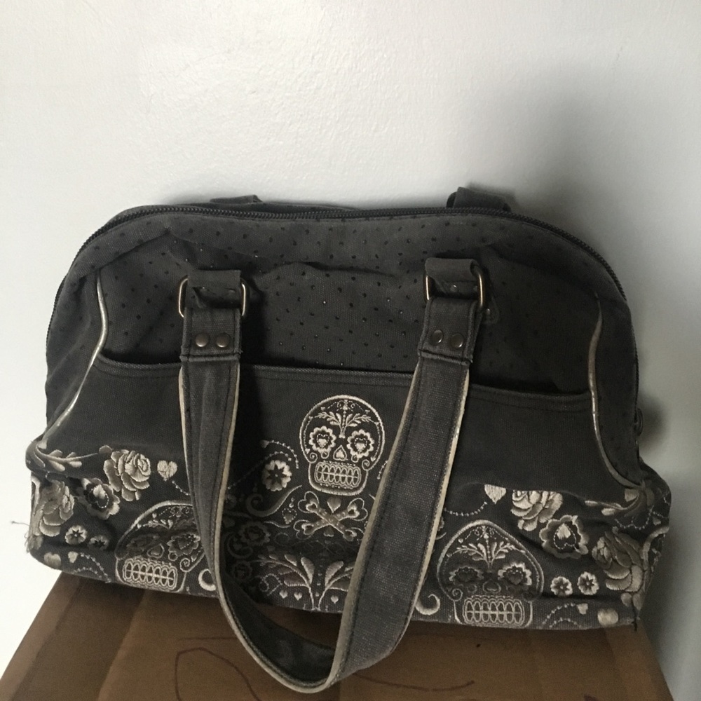 Lounge fly sugar skull purse.